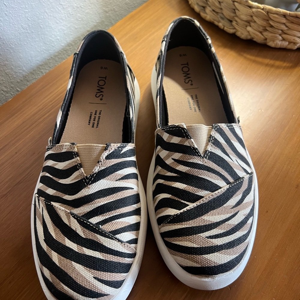 TOMS Black and White Zebra Pattern Slip-Ons